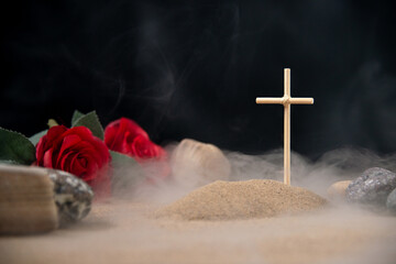 front view of little grave with red flowers and stones israel war palestine