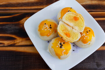 Chinese pastry puff, Beans cake with salted egg yolk lay on wood