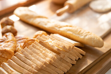 fresh bread and wheat on the wooden. Fresh fragrant bread on the table. Food concept.