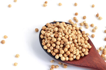 close up Coriander seeds in a wooden spoon on white background