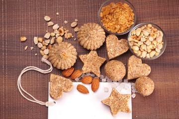 Homemade healthy and sweet groundnut or peanut and Jaggery Laddoo, delicious indian sweet served on a wooden background.Roasted peanut isolated.
