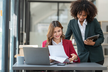 Young Asian and African businesswoman Africans brainstorming on real estate projects. investment plan Financial business together in the office management concept management.