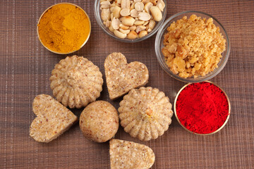 Homemade healthy and sweet groundnut or peanut and Jaggery Laddoo, delicious indian sweet served on a wooden background.Roasted peanut isolated.