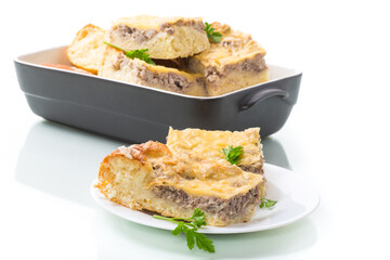 Cooked meat pie, pieces in a plate