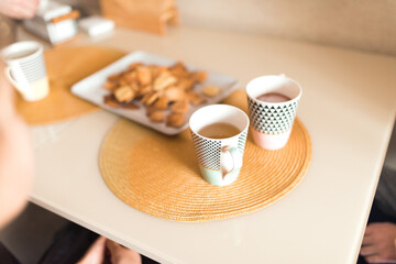 Cooking at home, drinking tea, dish with homemade cookies