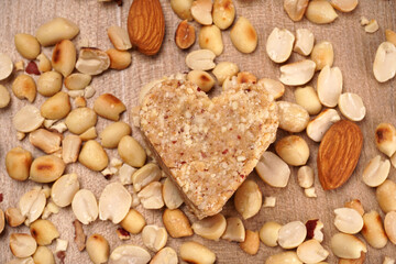 Homemade healthy and sweet groundnut or peanut and Jaggery Laddoo, delicious indian sweet served on a wooden background.Roasted peanut isolated.