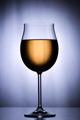 Glass of white wine on  white background