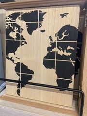 world map on blackboard, key box 