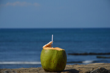 Natural coconut water with ocean in the background