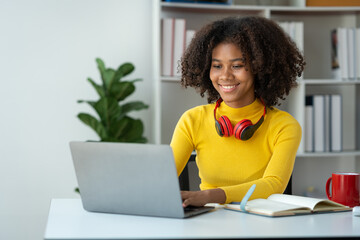 start-up business, young african woman american used laptop computer typing Search online for financial business information. Marketing from various applications at home office concept of living.