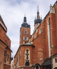 Fototapeta na wymiar Basilica of St Mary and Church of St Barbara in Old Town, historic part of Krakow, Poland