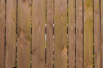 brown wooden fence made of boards, street fencing