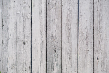 wooden fence made of unpainted boards, close-up shot