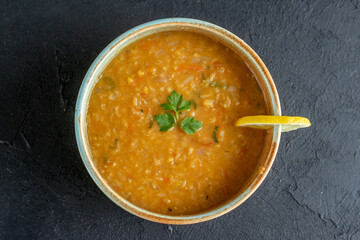 top view delicious lentil soup with lemon slice inside plate on dark surface dinner dish meal food bread diner horizontal colourful