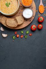 top view lentil soup with salt raw lentils and dark bread loafs on dark surface diner food colourful dish bread meal