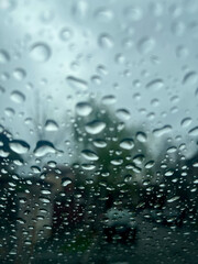Closeup of rain splashes on the car window
