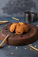 front view delicious chocolate cookies with candles on the dark-grey background cookie biscuit sugar tea sweet