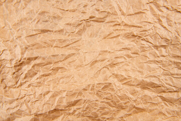 Fototapeta premium Brown crumpled paper background vignette
