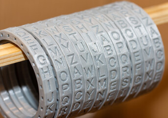 Close-up of plastic parts printed on a 3D printer, round letters rings for cryptex - preparing for...