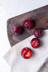 top view red sour plums fresh mellow and ripe on the white desk fruit summer sour round