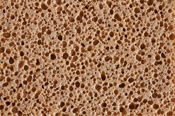 Foam sponge texture. The pores are clearly visible in close-up.