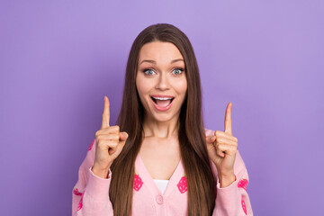 Closeup photo of young funny girl brown hair direct fingers up empty space wear pink shirt unexpected crazy sale isolated on purple color background