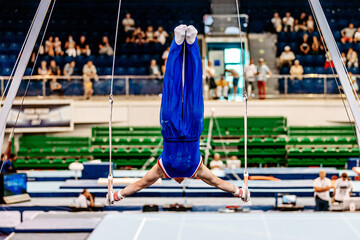 athlete gymnast exercise ring frame in championship gymnastics artistic, summer sport games