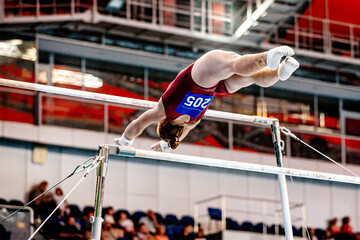 female athlete gymnast exercise on uneven bars in gymnastics, summer sports games