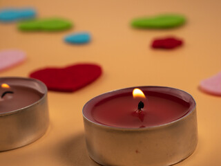 Scented candles for relaxing on a beige background. Close-up.