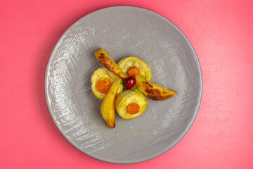 top view cooked squash slices inside grey plate on pink background food vegetable dinner dish color
