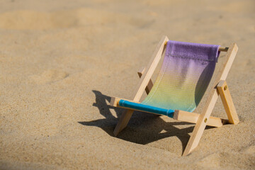 Sunny holidays on the beach sand beach accessories. Sun lounger stand sea. Wooden beach chairs. Summer holiday vacation concept. Copy space for your text 