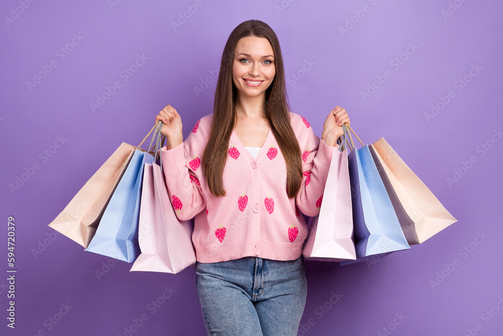 Poster photo of cute pretty girl wear berry print cardigan smiling rising shoppers isolated violet color ba