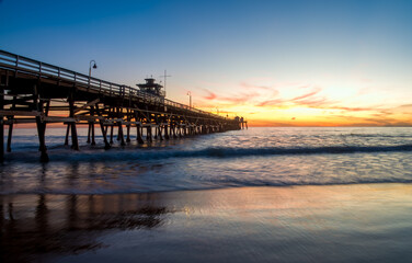 Fototapeta na wymiar Sunset over the San Clemente pier, Orange County, California, USA.