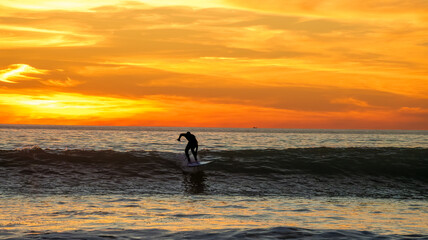 Surfer at Sunset, San Clemente beach, Orange County, California, USA