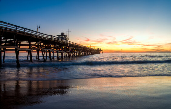 Sunset over the San Clemente pier, Orange County, California, USA.
