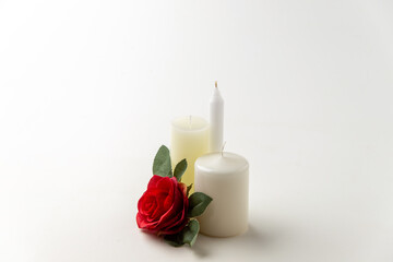 light candles with red rose on white background flame lamp fire