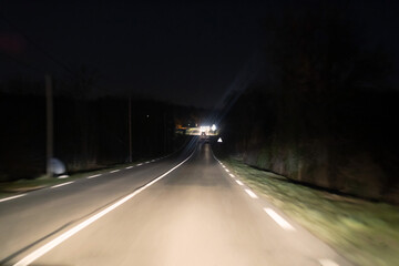 Fototapeta na wymiar Driving at night in a France Europe - One line asphalt Road from Lyon