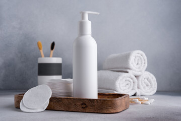 Bath and skin care accessories on gray background