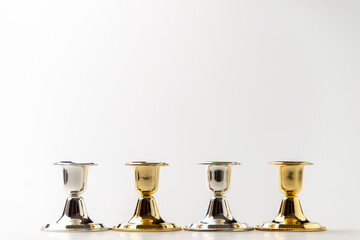 front view of elegant candlesticks on white background metallic steel lamp