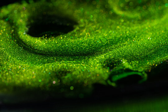 Shiny particles of metallic paint