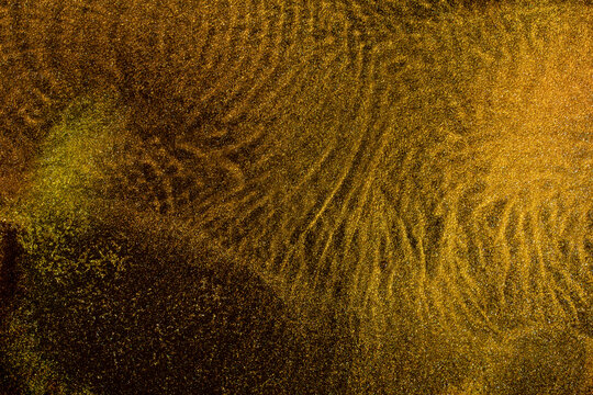 Shiny particles of metallic paint