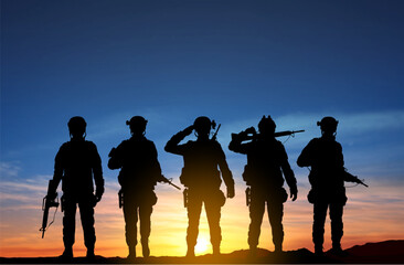 Fototapeta na wymiar Silhouettes of a soliders against the sunset. EPS10 vector
