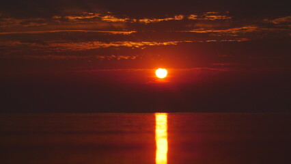 Dramatic Orange Sunrise Over The Water