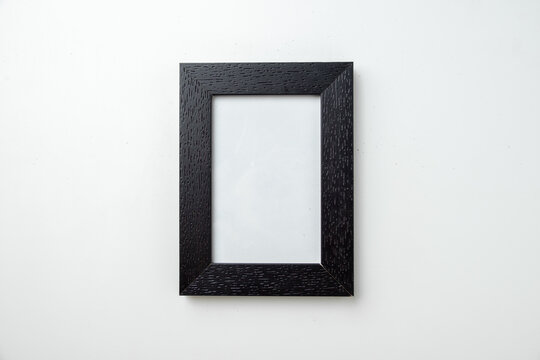 top view empty picture frame on white background funeral death