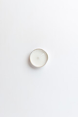 top view of round candle on white background flame lamp fire
