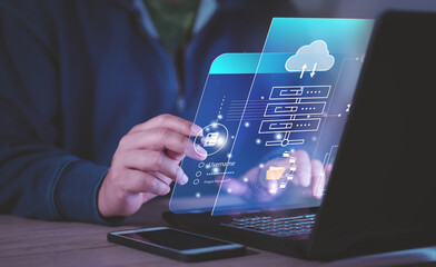 businessman uses a Laptop with technology cloud computing for data transmission, database, data storage, and backup. Networking and internet service concept. Cloud service. Cloud Computer technology.