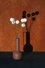Still life with a bouquet of balloons in a vase with a shadow