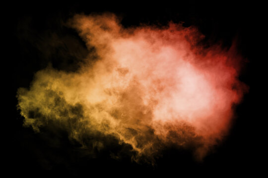 Colorful smoke close-up on a black background, wallpaper.
