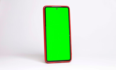 Celular con pantalla verde, de lado, en fondo blanco con sombra, horizontal, con funda roja