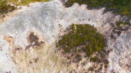 Aerial view of Solfatara of Pozzuoli, near Naples, Italy. It is a dormant volcano and part of the Phlegraean Fields volcanic area. It emits jets of steam with sulfurous fumes.